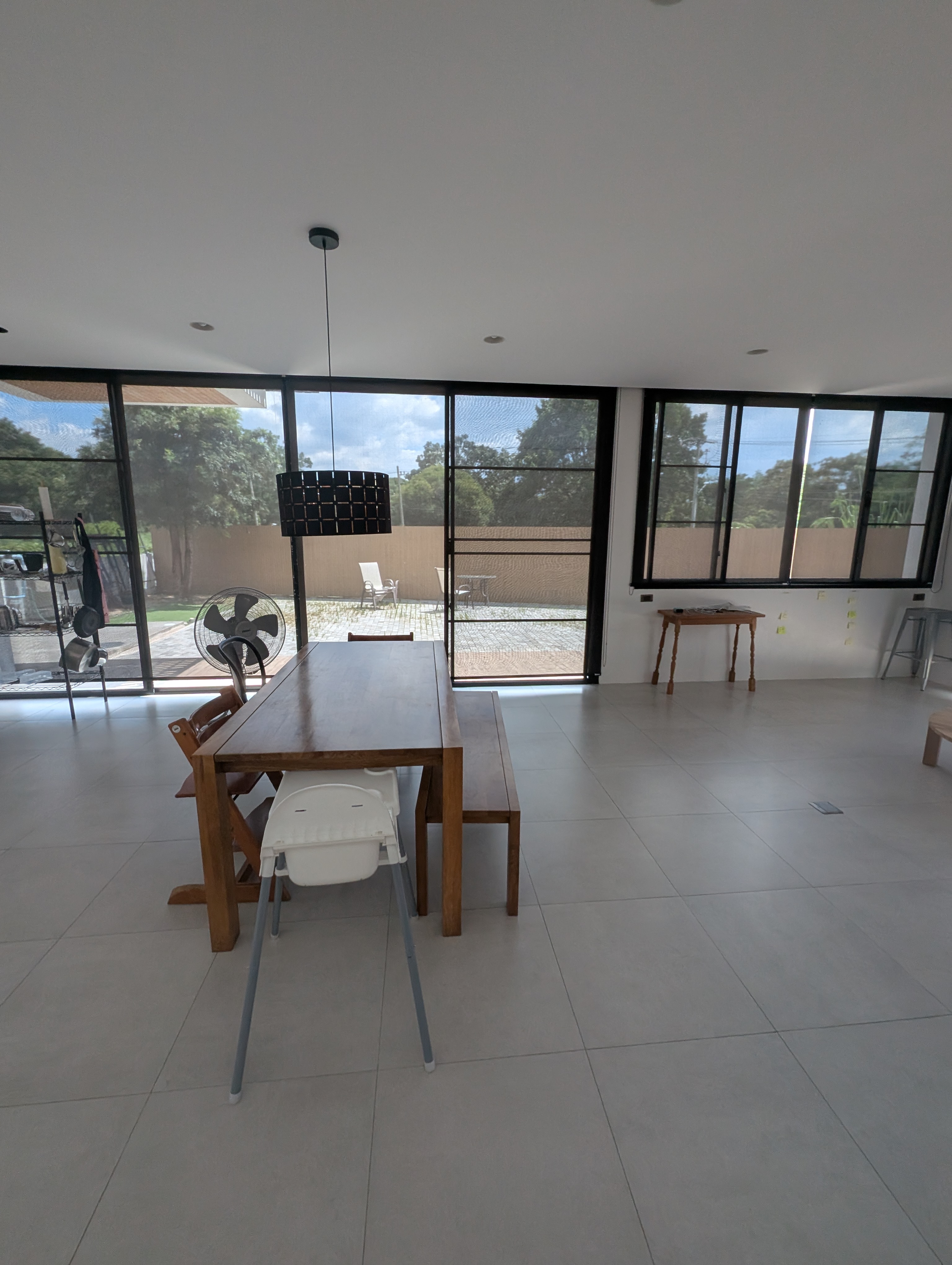 Dining area beside large glass doors looking onto the outdoors